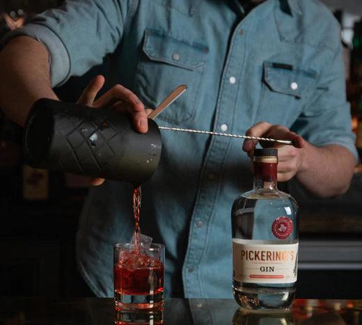 Bartender pouring a Negroni