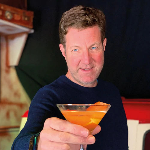 Marcus Pickering holding a cocktail