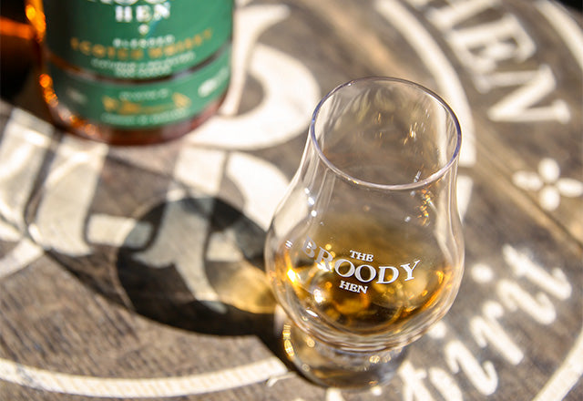 Dram of The Broody Hen on a cask