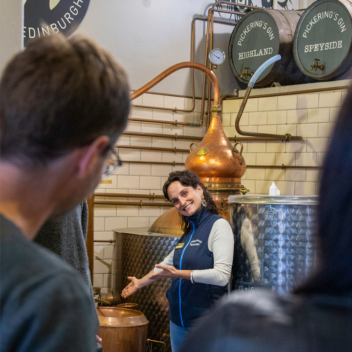 Tour guide pointing at stills