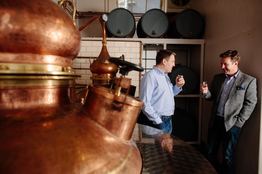 Matt and Marcus tasting Pickering's Gin next to stills