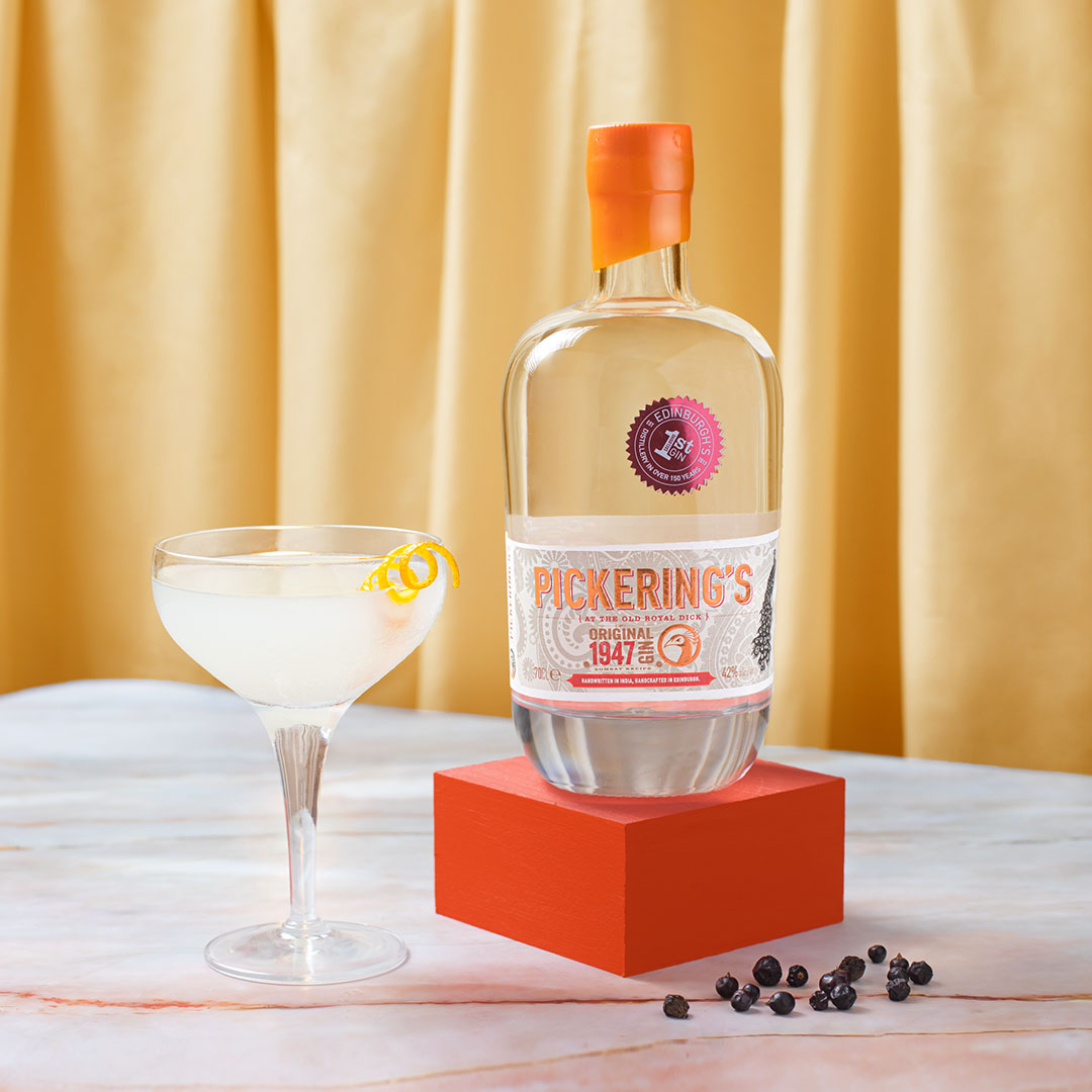 Pickering's Original 1947 Gin next to a cocktail
