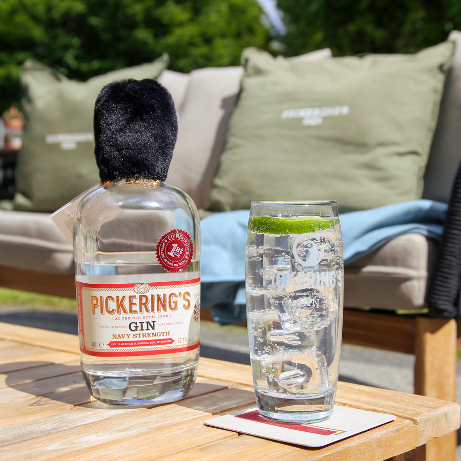 Pickering's Navy Strength Gin next to a Gin and tonic outside