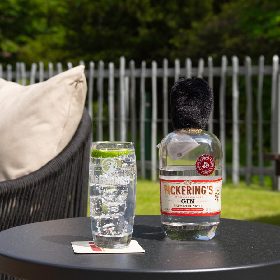 Pickering's Navy Strength Gin next to a Gin and tonic outside