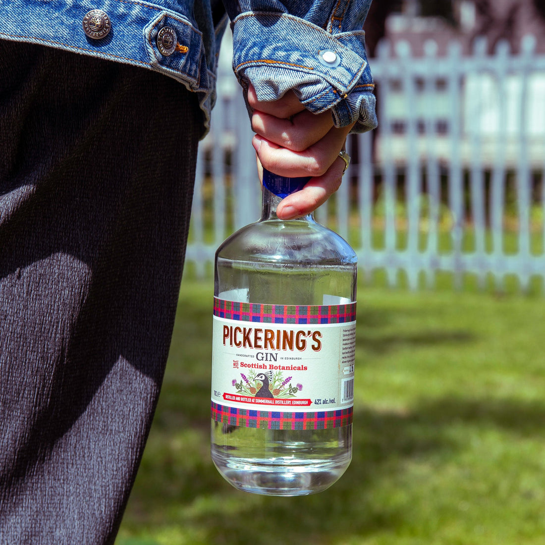 Someone holding bottle of Pickering&