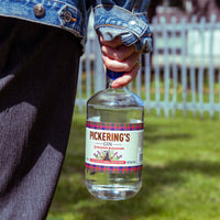 Someone holding bottle of Pickering's Gin in hand