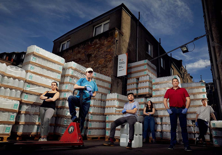 The Summerhall Distillery team outside with hand sanitiser