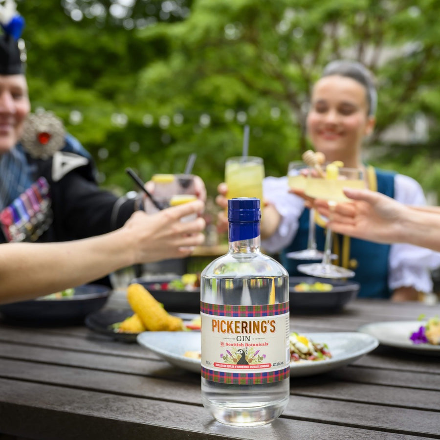 Pickering's Gin bottle on a table with unfocused background of people